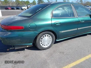 1999 Mercury Sable LS z VIN 1MEFM53S7XA612899, wystawiony jako IAAI lot #41687188 z przebiegiem 155 128 mil mil oraz . Historia ofert i sprzedaży dostępna na DreamBid. Obrazek 14.