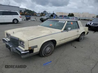 1984 Cadillac Eldorado z VIN 1G6AL5784EE673617, wystawiony jako Copart lot #50650305 z przebiegiem 21 482 mil mil oraz Nie do naprawy • Non repairable. Historia ofert i sprzedaży dostępna na DreamBid. Obrazek 1.
