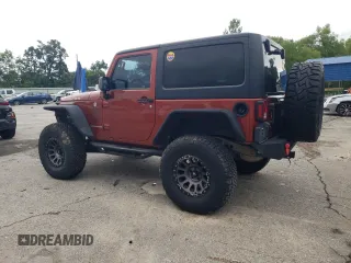 2014 Jeep Wrangler Rubicon with VIN 1C4BJWCG2EL303420, listed as a Copart auction lot 63550985 with 87,175 mi miles and Salvage title. Bid and sale history available at DreamBid. Image 2.