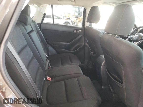 2016 Mazda CX-5 Touring z VIN JM3KE2CY4G0805072, wystawiony jako Copart lot #58435535 z przebiegiem 146 323 mil mil oraz Szkoda całkowita • Salvage title. Historia ofert i sprzedaży dostępna na DreamBid. Obrazek 10.