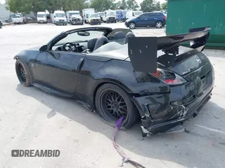 2004 Nissan 350Z Touring z VIN JN1AZ36A14M253275, wystawiony jako IAAI lot #42181345 z przebiegiem 63 886 mil mil oraz . Historia ofert i sprzedaży dostępna na DreamBid. Obrazek 3.