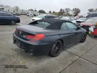 2014 BMW M6 z VIN WBSLZ9C50EDZ78599, wystawiony jako Copart lot #84724974 z przebiegiem 115 051 mil mil oraz Czysty tytuł • Clean title. Historia ofert i sprzedaży dostępna na DreamBid. Obrazek 3.