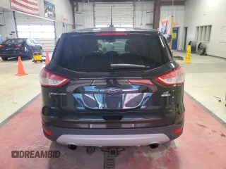 2014 Ford Escape SE with VIN 1FMCU9G99EUA06336, listed as a Copart auction lot 53871065 with 117,457 mi miles and Salvage title. Bid and sale history available at DreamBid. Image 6.