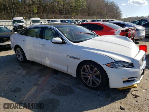 2017 Jaguar XJ with VIN SAJWJ2GD4H8W12163, listed as a Copart auction lot 86993064 with 63,697 mi miles and Salvage Title. Bid and sale history available at carsss.com. Image 4.