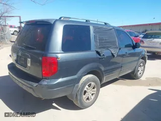 2004 Honda Pilot EX with VIN 2HKYF18574H532409, listed as a IAAI auction lot 41701760 with 302,949 mi miles. Bid and sale history available at carsss.com. Image 4.