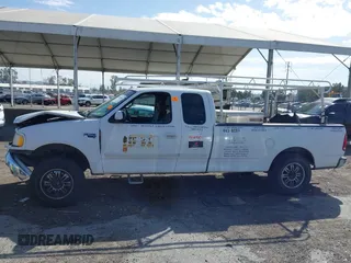 2002 Ford F-150 XL with VIN 1FTRX17L82NA54581, listed as a IAAI auction lot 41698662 with 220,321 mi miles. Bid and sale history available at carsss.com. Image 14.