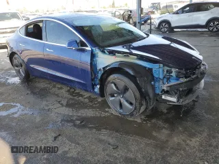 2020 Tesla Model 3 Standard Range Plus with VIN 5YJ3E1EA7LF705907, listed as a Copart auction lot 48765145 with 104,479 mi miles and Salvage Title. Bid and sale history available at DreamBid. Image 4.