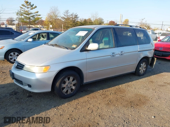 2004 Honda Odyssey EX-L with VIN 5FNRL18964B025323, listed as a IAAI auction lot 40714457 with 164,786 mi miles and . Bid and sale history available at DreamBid. Image 2.