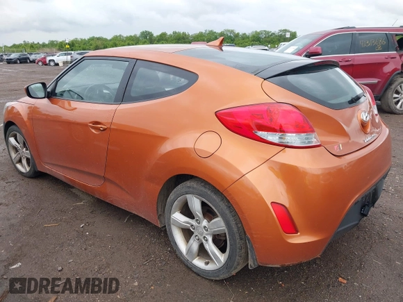 2012 Hyundai Veloster w/Gray Int with VIN KMHTC6AD3CU057620, listed as a IAAI auction lot 42320549 with 113,491 mi miles and . Bid and sale history available at DreamBid. Image 3.