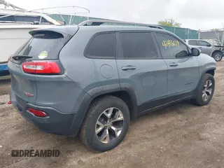 2014 Jeep Cherokee Trailhawk with VIN 1C4PJMBB5EW156315, listed as a IAAI auction lot 42426229 with 154,019 mi miles and . Bid and sale history available at DreamBid. Image 4.