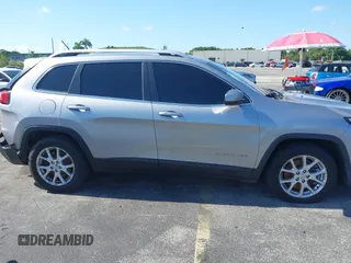 2014 Jeep Cherokee Latitude with VIN 1C4PJLCS6EW103423, listed as a IAAI auction lot 40118289 with 112,120 mi miles and . Bid and sale history available at DreamBid. Image 13.