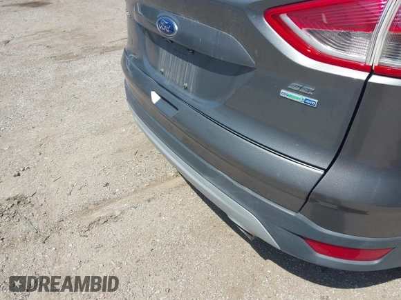2014 Ford Escape SE with VIN 1FMCU9GX0EUE12195, listed as a IAAI auction lot 42674879 with 96,576 mi miles and . Bid and sale history available at DreamBid. Image 6.