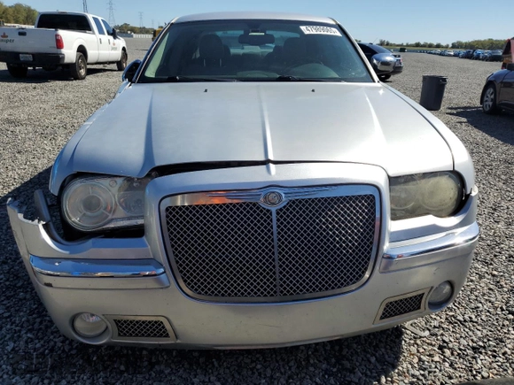 2005 Chrysler 300 with VIN 2C3AA63H95H657666, listed as a Copart auction lot 47989065 with 195,184 mi miles and Salvage Title. Bid and sale history available at carsss.com. Image 5.