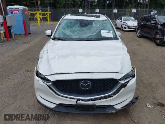 2018 Mazda CX-5 Grand Touring with VIN JM3KFBDM1J0382306, listed as a IAAI auction lot 42554947 with 121,303 mi miles and . Bid and sale history available at DreamBid. Image 6.