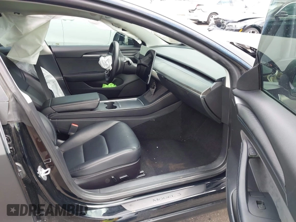 2022 Tesla Model 3 with VIN 5YJ3E1EA3NF287512, listed as a IAAI auction lot 42000557 with 77,619 mi miles. Bid and sale history available at carsss.com. Image 5.