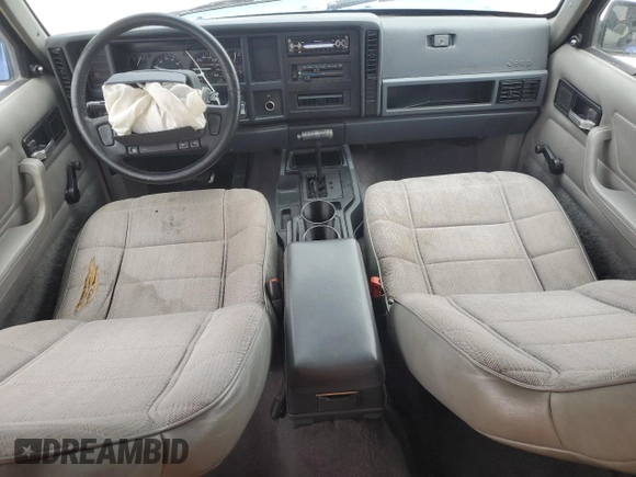 1996 Jeep Cherokee Sport z VIN 1J4FT68S8TL128381, wystawiony jako Copart lot #57496175 z przebiegiem 221 330 mil mil oraz Szkoda całkowita • Salvage title. Historia ofert i sprzedaży dostępna na DreamBid. Obrazek 8.