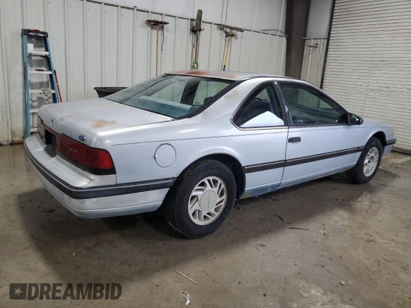 1990 Ford Thunderbird with VIN 1FAPP6047LH140817, listed as a Copart auction lot 83910194 with 177,909 mi miles and Salvage Title. Bid and sale history available at DreamBid. Image 3.