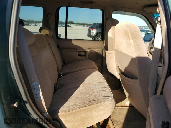1997 Ford Explorer XL with VIN 1FMDU34E5VZB40878, listed as a Copart auction lot 84009744 with 185,047 mi miles and Salvage title. Bid and sale history available at DreamBid. Image 11.