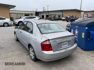 2004 Kia Spectra LX with VIN KNAFE121845043143, listed as a IAAI auction lot 41574523 with 211,758 mi miles. Bid and sale history available at carsss.com. Image 3.