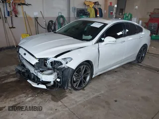 2019 Ford Fusion Titanium with VIN 3FA6P0D92KR153096, listed as a IAAI auction lot 41679393 with 127,292 mi miles and . Bid and sale history available at DreamBid. Image 2.