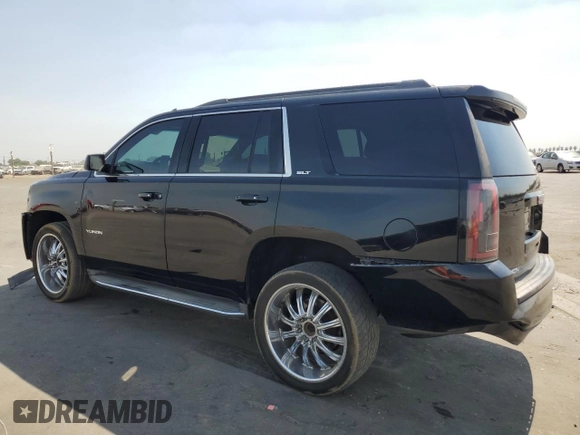 2016 GMC Yukon SLT with VIN 1GKS1BKCXGR122111, listed as a Copart auction lot 69900124 with 73,781 mi miles and Salvage Title. Bid and sale history available at carsss.com. Image 2.