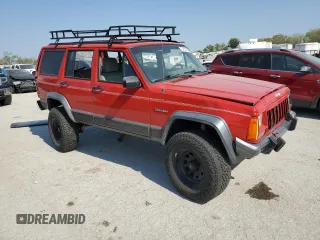 1996 Jeep Cherokee Country with VIN 1J4FJ78S9TL130605, listed as a Copart auction lot 74673934 with 196,857 mi miles and Salvage Title. Bid and sale history available at carsss.com. Image 4.