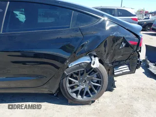 2025 Tesla Model 3 Long Range with VIN 5YJ3E1EA5SF919681, listed as a IAAI auction lot 41818042 with 2,173 mi miles and . Bid and sale history available at DreamBid. Image 6.