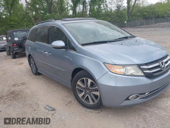 2014 Honda Odyssey Touring with VIN 5FNRL5H91EB081811, listed as a IAAI auction lot 42153920 with 16 mi miles and . Bid and sale history available at DreamBid. Image 1.