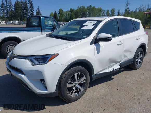 2018 Toyota RAV4 XLE with VIN JTMWFREV3JD130995, listed as a IAAI auction lot 42183630 with 56,624 mi miles. Bid and sale history available at carsss.com. Image 18.