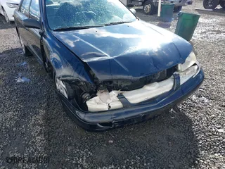 2000 Mazda 626 LX with VIN 1YVGF22CXY5123930, listed as a IAAI auction lot 40712369 with 210,234 mi miles. Bid and sale history available at carsss.com. Image 6.