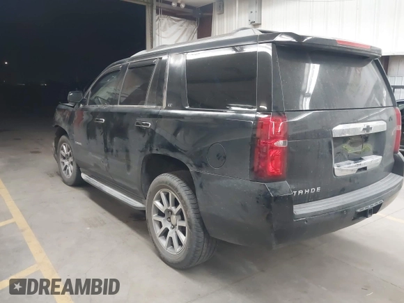 2015 Chevrolet Tahoe LT z VIN 1GNSCBKC1FR228488, wystawiony jako IAAI lot #41933869 z przebiegiem 164 523 mil mil oraz . Historia ofert i sprzedaży dostępna na DreamBid. Obrazek 3.