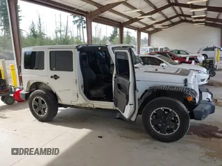 2012 Jeep Wrangler Unlimited Sahara with VIN 1C4BJWEG7CL275883, listed as a IAAI auction lot 42510764 with 149,531 mi miles and . Bid and sale history available at DreamBid. Image 14.