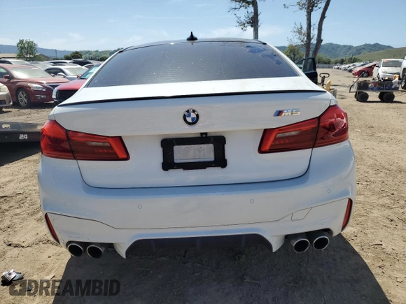 2019 BMW M5 z VIN WBSJF0C56KB446714, wystawiony jako Copart lot #52604265 z przebiegiem 63 401 mil mil oraz Szkoda całkowita • Salvage title. Historia ofert i sprzedaży dostępna na DreamBid. Obrazek 6.
