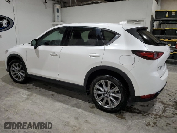 2021 Mazda CX-5 Grand Touring with VIN JM3KFBDM4M1344602, listed as a Copart auction lot 82793724 with 69,322 mi miles and Salvage Title. Bid and sale history available at carsss.com. Image 2.