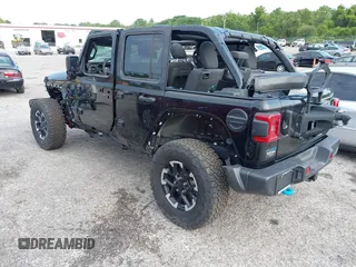 2024 Jeep Wrangler Rubicon X z VIN 1C4RJXR64RW197186, wystawiony jako IAAI lot #42405700 z przebiegiem 6 397 mil mil oraz . Historia ofert i sprzedaży dostępna na DreamBid. Obrazek 3.