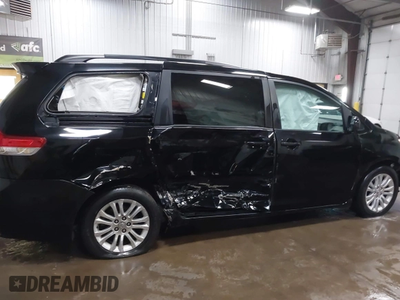 2011 Toyota Sienna XLE AAS with VIN 5TDYK3DC3BS141051, listed as a IAAI auction lot 41741058 with 236,626 mi miles. Bid and sale history available at carsss.com. Image 13.
