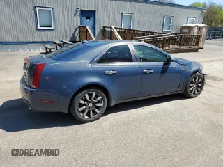 2009 Cadillac CTS AWD with VIN 1G6DH577390123365, listed as a Copart auction lot 54815885 with 141,026 mi miles and Salvage Title. Bid and sale history available at DreamBid. Image 3.