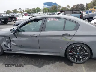 2022 BMW 5 Series M550i xDrive with VIN WBA13BK07NCL07995, listed as a IAAI auction lot 42454963 with 12,721 mi miles and . Bid and sale history available at DreamBid. Image 14.