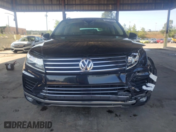 2017 Volkswagen Touareg Sport with VIN WVGEF7BP8HD000237, listed as a Copart auction lot 52714074 with 107,463 mi miles and . Bid and sale history available at DreamBid. Image 5.