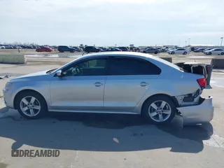 2014 Volkswagen Jetta TDI w/Premium with VIN 3VWLL7AJ6EM424935, listed as a IAAI auction lot 41533634 with 64,028 mi miles and . Bid and sale history available at DreamBid. Image 14.