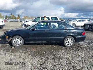 2000 Mazda 626 LX with VIN 1YVGF22CXY5123930, listed as a IAAI auction lot 40712369 with 210,234 mi miles. Bid and sale history available at carsss.com. Image 14.