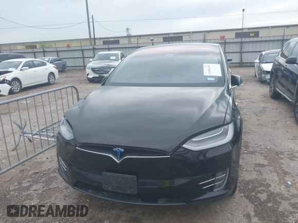 2021 Tesla Model X Long Range Plus with VIN 5YJXCAE27MF324270, listed as a IAAI auction lot 41886101 with 59,614 mi miles and . Bid and sale history available at carsss.com. Image 6.