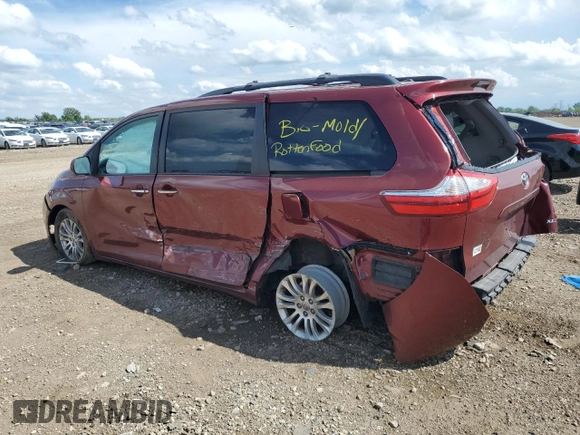 2016 Toyota Sienna XLE with VIN 5TDYK3DC5GS730870, listed as a Copart auction lot 62107505 with 131,619 mi miles and Salvage title. Bid and sale history available at DreamBid. Image 2.