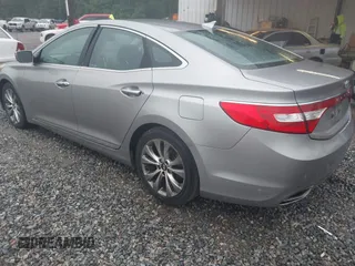 2013 Hyundai Azera z VIN KMHFG4JG7DA199553, wystawiony jako IAAI lot #42218944 z przebiegiem 131 959 mil mil oraz . Historia ofert i sprzedaży dostępna na DreamBid. Obrazek 3.