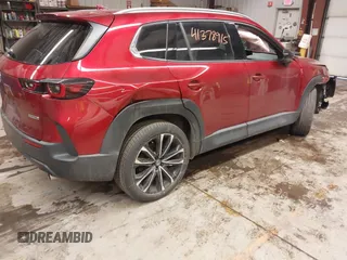 2023 Mazda CX-50 S Premium Plus with VIN 7MMVABEM8PN105411, listed as a IAAI auction lot 41378915 with 34,866 mi miles and . Bid and sale history available at DreamBid. Image 4.