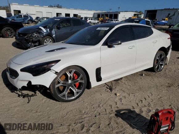 2021 Kia Stinger GT2 with VIN KNAE55LC1M6089121, listed as a Copart auction lot 74823434 with 25,009 mi miles and Salvage Title. Bid and sale history available at carsss.com. Image 1.