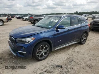 2018 BMW X1 xDrive28i z VIN WBXHT3C34J5K31850, wystawiony jako Copart lot #60561155 z przebiegiem 80 337 mil mil oraz Szkoda całkowita • Salvage title. Historia ofert i sprzedaży dostępna na DreamBid. Obrazek 1.