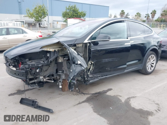 2017 Tesla Model X 90D with VIN 5YJXCAE2XHF075341, listed as a IAAI auction lot 41784008 with 77,439 mi miles and . Bid and sale history available at DreamBid. Image 18.