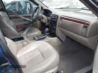 2001 Jeep Grand Cherokee Limited with VIN 1J4GX58S01C657436, listed as a IAAI auction lot 42102133 with 194,897 mi miles and . Bid and sale history available at DreamBid. Image 5.