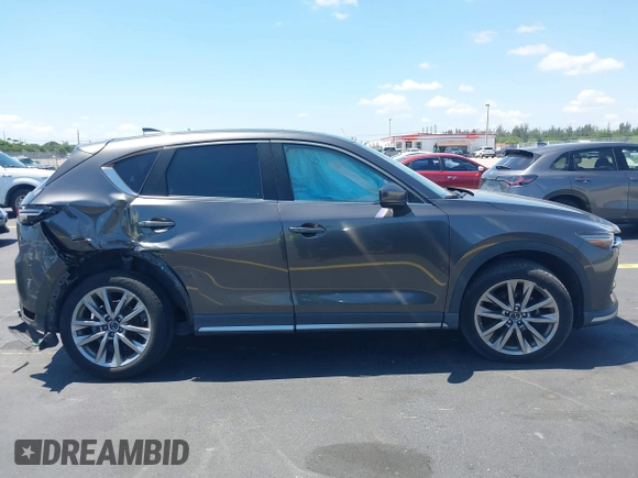 2018 Mazda CX-5 Grand Touring with VIN JM3KFADM8J1310328, listed as a IAAI auction lot 42322780 with 106,378 mi miles and . Bid and sale history available at DreamBid. Image 14.
